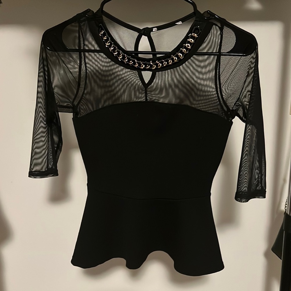 small black with mesh and gold detail peplum top